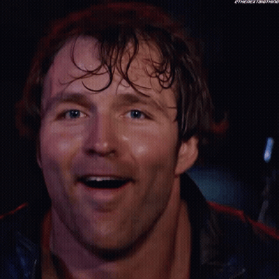 A Close Up Of A Man 'S Face Smiling With His Mouth Open . GIF