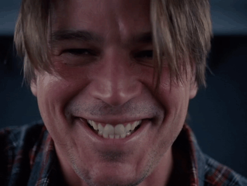 A Close Up Of A Man 'S Face Smiling GIF