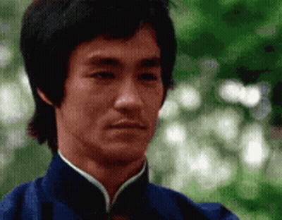 A Close Up Of A Man 'S Face Wearing A Blue Jacket . GIF