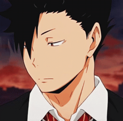 A Close Up Of A Man 'S Face Wearing A Suit And Tie With His Eyes Closed GIF