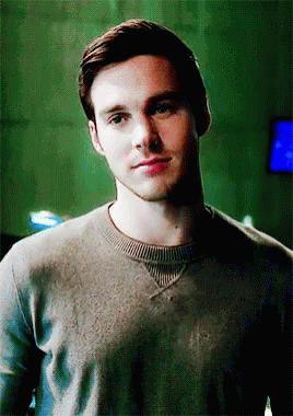 A Close Up Of A Man 'S Face Wearing A Sweater GIF