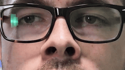 A Close Up Of A Man 'S Face Wearing Glasses And A Beard GIF