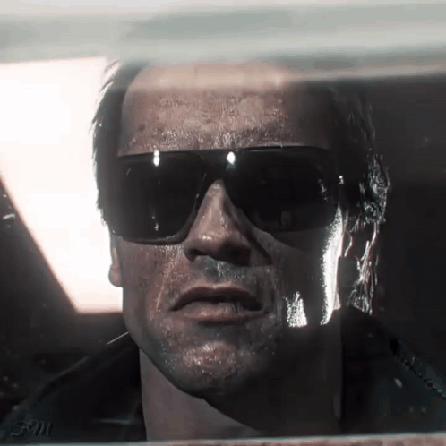 A Close Up Of A Man 'S Face Wearing Sunglasses With The Word Evil On The Bottom GIF