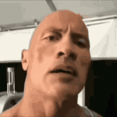 A Close Up Of A Man 'S Face With A Bald Head And A Serious Look On His Face . GIF