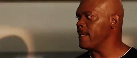 A Close Up Of A Man 'S Face With A Bald Head . GIF