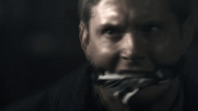 A Close Up Of A Man 'S Face With A Bandage On His Mouth GIF
