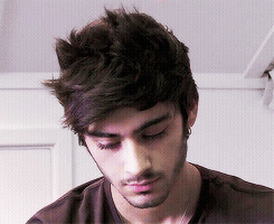 A Close Up Of A Man 'S Face With A Beard GIF