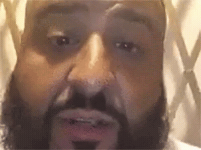 A Close Up Of A Man 'S Face With A Beard . GIF