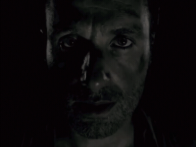 A Close Up Of A Man 'S Face With A Beard And A Black Eye . GIF
