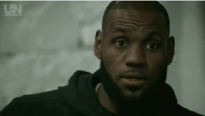 A Close Up Of A Man 'S Face With A Beard And A Black Hoodie . GIF