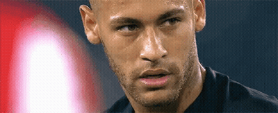 A Close Up Of A Man 'S Face With A Beard And A Black Shirt On . GIF
