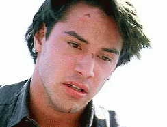 A Close Up Of A Man 'S Face With A Beard And A Black Shirt . GIF