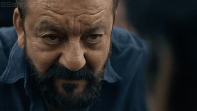 A Close Up Of A Man 'S Face With A Beard And A Blue Shirt With A Watermark That Says @Sanjeev GIF
