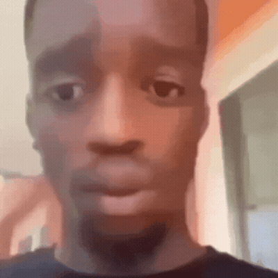 A Close Up Of A Man 'S Face With A Beard And A Blurred Background . GIF