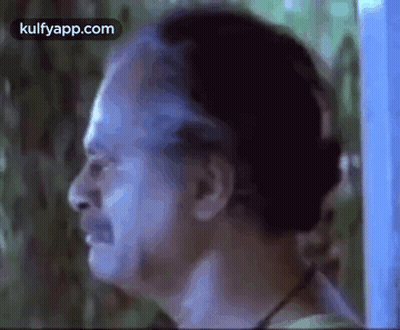 A Close Up Of A Man 'S Face With A Beard And A Mustache . GIF