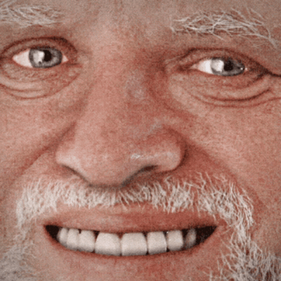 A Close Up Of A Man 'S Face With A Beard And A Smile GIF