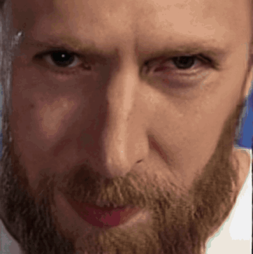 Close Up Of Bearded Man In White Shirt GIF