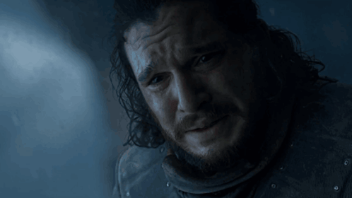 A Close Up Of A Man 'S Face With A Beard And Long Hair GIF