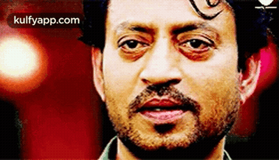 A Close Up Of A Man 'S Face With A Beard And Mustache . GIF