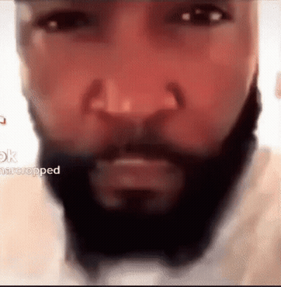 A Close Up Of A Man 'S Face With A Beard And Mustache . GIF
