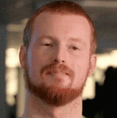 A Close Up Of A Man 'S Face With A Beard And Red Hair GIF