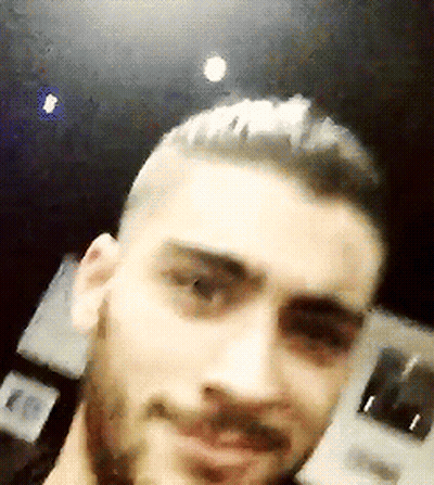 A Close Up Of A Man 'S Face With A Beard And Short Hair GIF