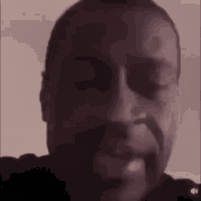 A Close Up Of A Man 'S Face With A Beard And Sunglasses On . GIF