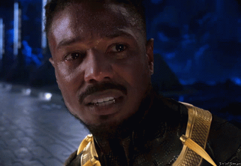 A Close Up Of A Man 'S Face With A Beard And Teeth GIF