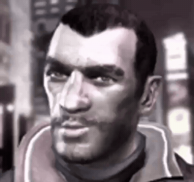 A Close Up Of A Man 'S Face With A Beard In A Black And White Photo . GIF