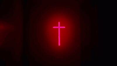 A Close Up Of A Man 'S Face With A Beard In A Dark Room GIF