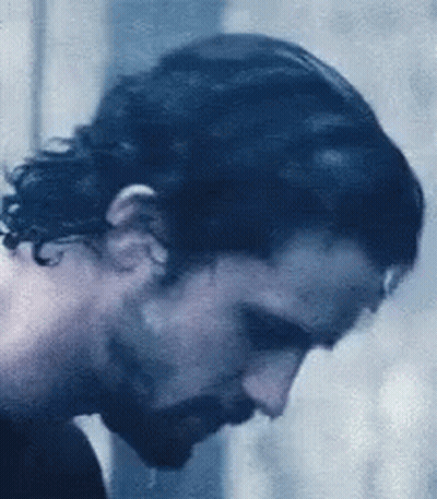 A Close Up Of A Man 'S Face With A Beard . GIF