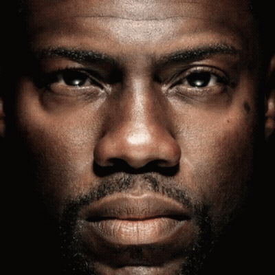 A Close Up Of A Man 'S Face With A Beard Looking At The Camera GIF