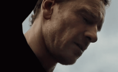 A Close Up Of A Man 'S Face With A Beard GIF