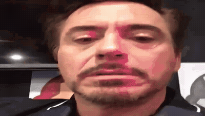 A Close Up Of A Man 'S Face With A Beard Making A Face . GIF