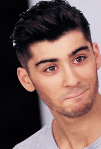 A Close Up Of A Man 'S Face With A Beard Making A Funny Face GIF