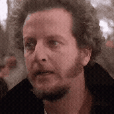 A Close Up Of A Man 'S Face With A Beard Making A Funny Face . GIF