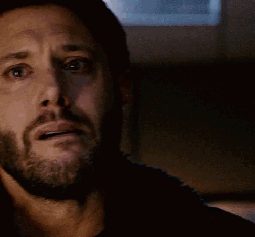 A Close Up Of A Man 'S Face With A Beard Making A Surprised Face . GIF