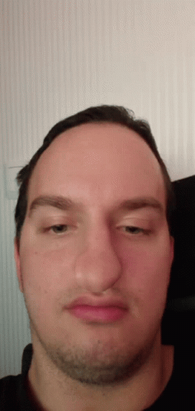 A Close Up Of A Man 'S Face With A Beard GIF
