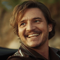 A Close Up Of A Man 'S Face With A Beard Smiling GIF