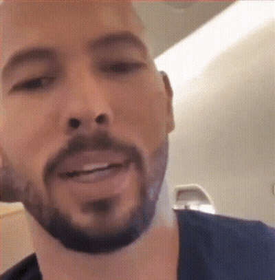 A Close Up Of A Man 'S Face With A Beard Smiling GIF