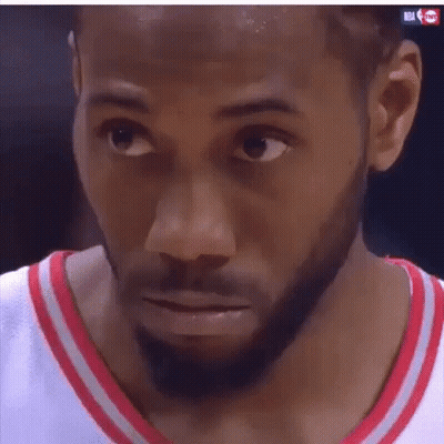 A Close Up Of A Man 'S Face With A Beard Wearing A Red And White Jersey . GIF