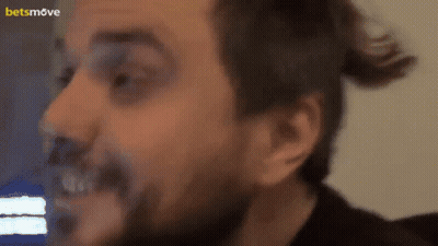 A Close Up Of A Man 'S Face With A Betsmove Logo In The Corner GIF