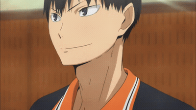 A Close Up Of A Man 'S Face With A Black And Orange Shirt GIF