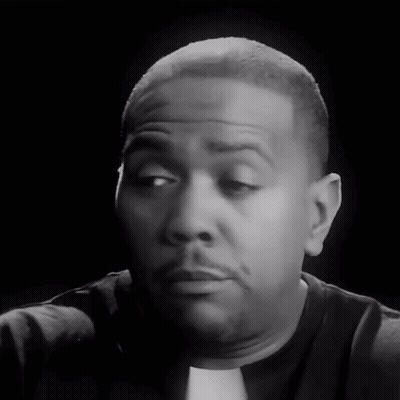 A Close Up Of A Man 'S Face With A Black Background GIF