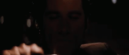 A Close Up Of A Man 'S Face With A Black Background GIF