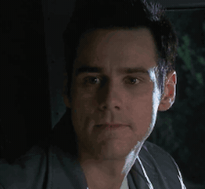 A Close Up Of A Man 'S Face With A Black Background GIF