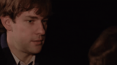 A Close Up Of A Man 'S Face With A Black Background GIF