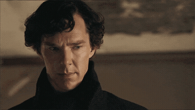 A Close Up Of A Man 'S Face With A Black Coat On GIF