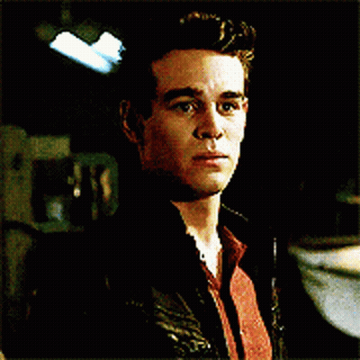 A Close Up Of A Man 'S Face With A Black Jacket On GIF