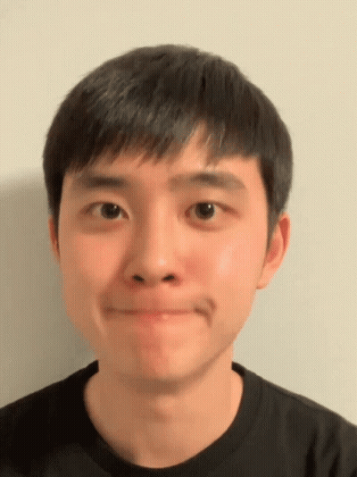 A Close Up Of A Man 'S Face With A Black Shirt On GIF